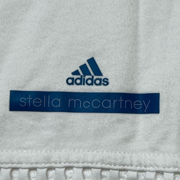 White adidas work out active shirt with mesh on the top and bottom. - Picture 6 of 8